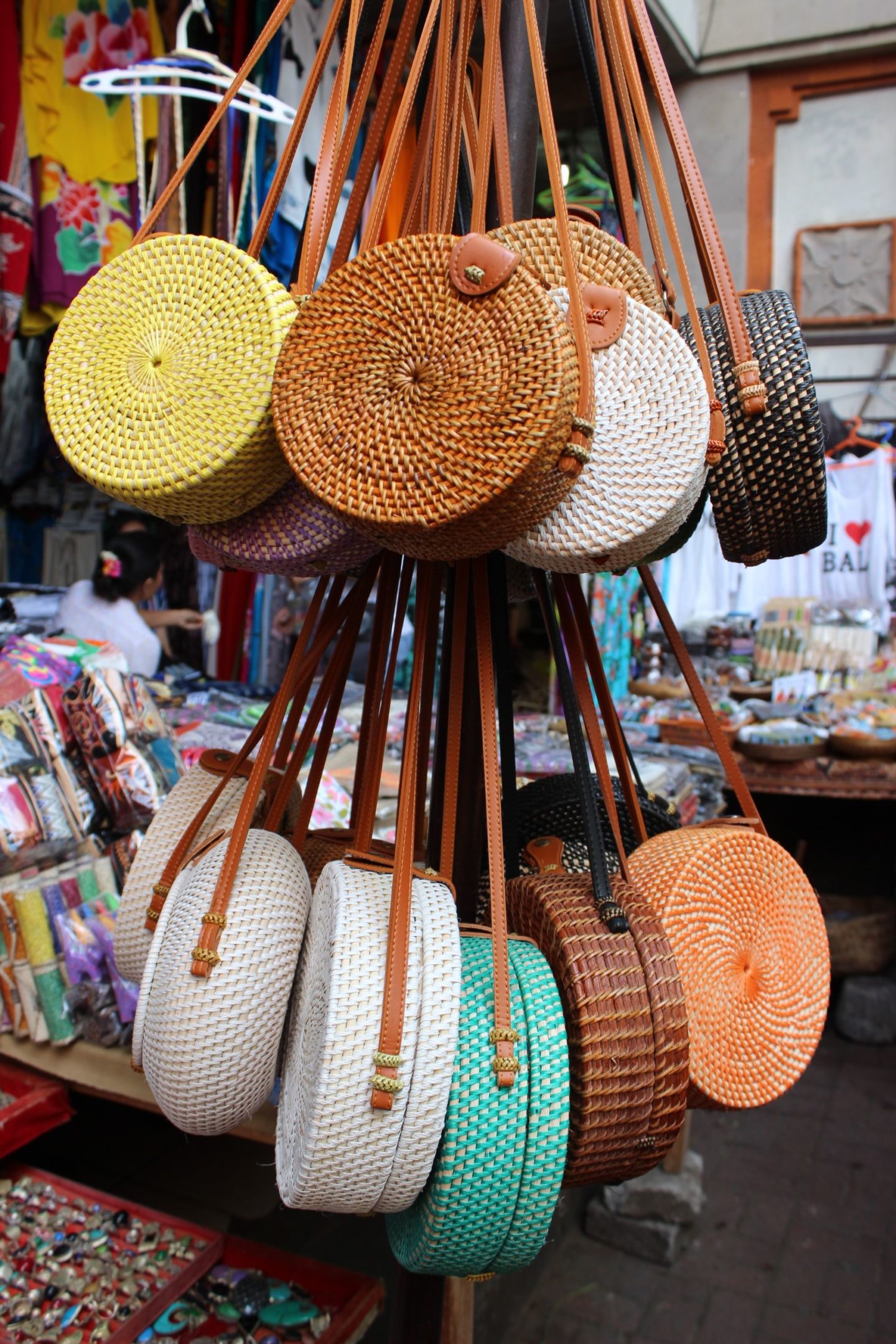 If you’ve ever heard of the Ubud Art Market, then you’ve probably also heard about the “Bali bag.” It’s a beautiful style of woven material that makes the perfect accessory for any traveller. Bali bags come in different shapes, but most typically, you’ll see people sporting the round ones with colourful fabric linings. You can find them at any tourist stand; the Balinese know that, for some reason, most travellers “need” this bag.